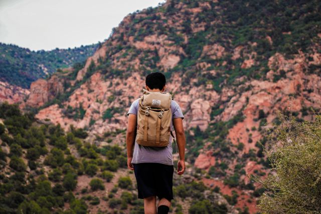 backpacker hikes a stunning mountain trail