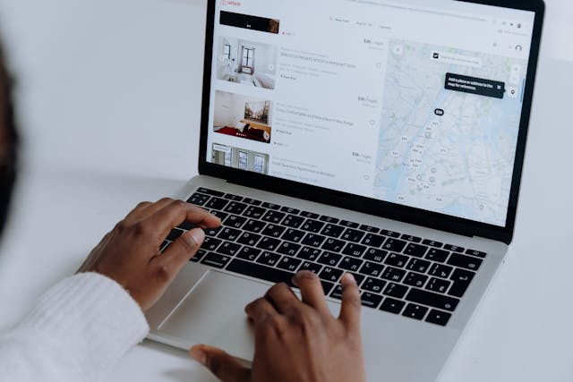 someone looking at an online rental listing site