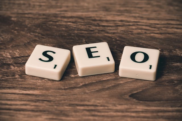 "SEO" written out in scrabble tiles on a table