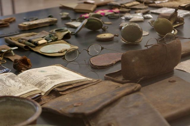 antique artifacts including glasses and documents